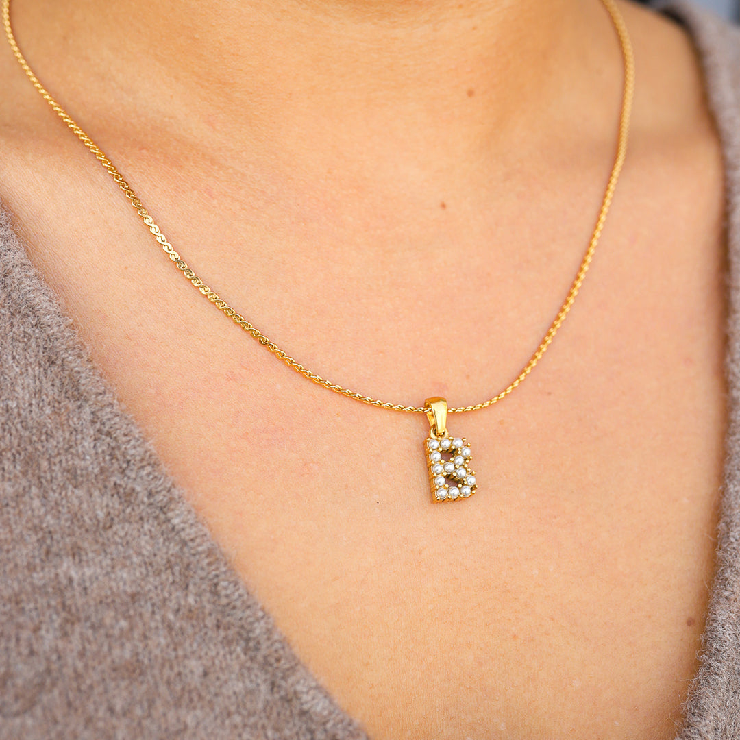PEARL LETTER PENDANT.